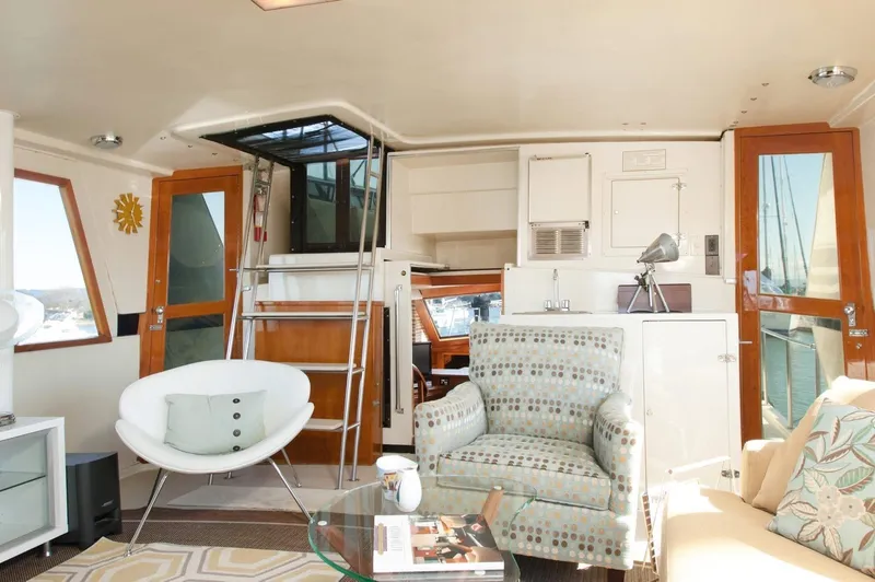 Slide: The Image of Interior of 1986 Californian 55 Cockpit Motor Yacht with modern seating and decor. - 4