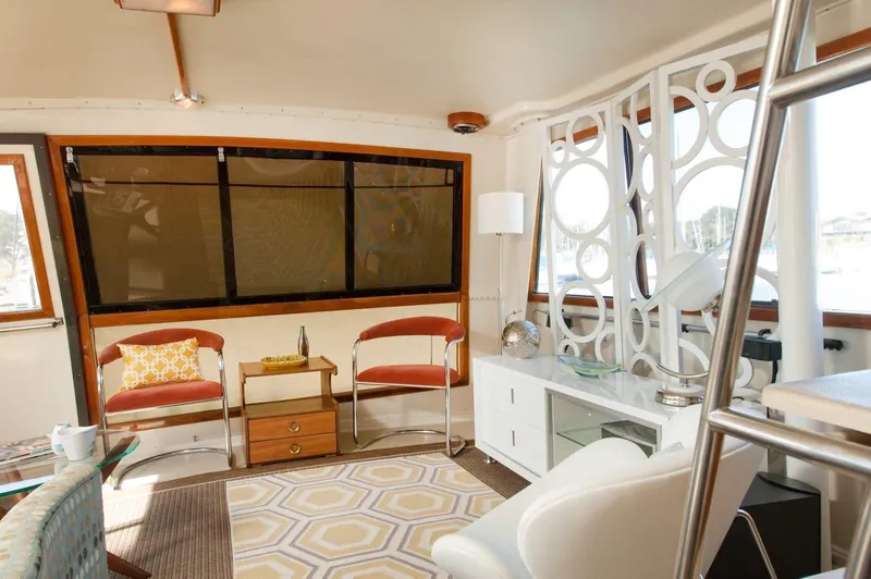Slide: The Image of Interior of 1986 Californian 55 Cockpit Motor Yacht with modern decor and seating. - 5