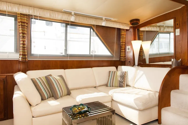 Slide: The Image of Luxurious interior of 1986 Californian 55 Cockpit Motor Yacht with white sectional sofa. - 8