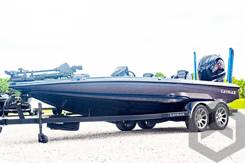 Slide: The Image of 2025 Caymas CX 21 PRO boat on trailer, side view, outdoors. - 1