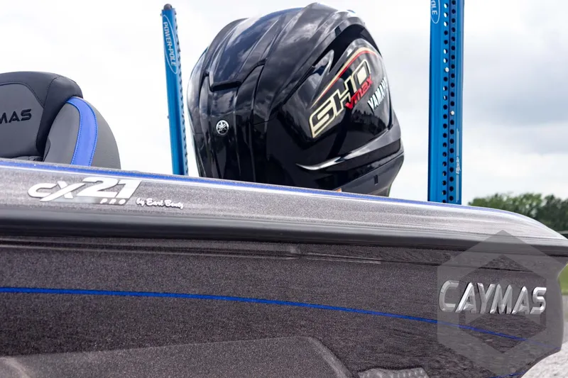 Slide: The Image of 2025 Caymas CX 21 PRO boat with Yamaha engine, featuring sleek design and branding. - 12