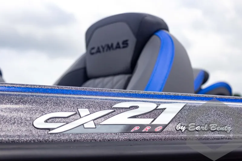 Slide: The Image of 2025 Caymas CX 21 PRO boat with sleek design and branding details. - 14