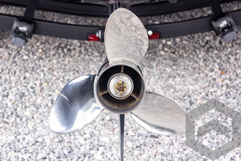 Slide: The Image of Propeller of 2025 Caymas CX 21 PRO boat on gravel surface. - 18