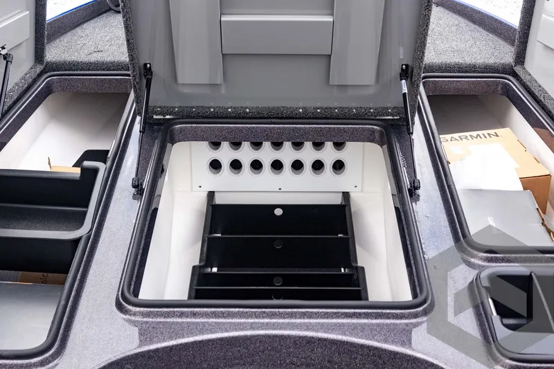 Slide: The Image of 2025 Caymas CX 21 PRO boat storage compartments with organized rod holders and tackle storage. - 27