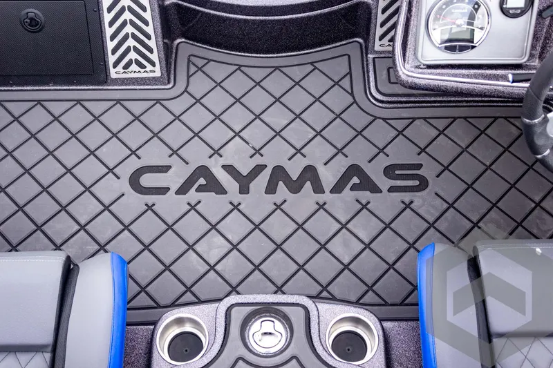 Slide: The Image of 2025 Caymas CX 21 PRO boat interior with logo and cup holders. - 33