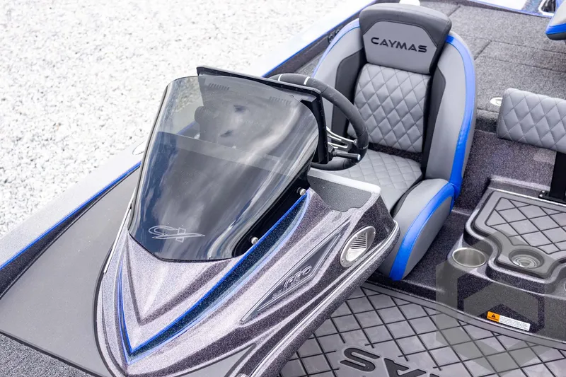 Slide: The Image of 2025 Caymas CX 21 PRO boat cockpit with sleek design and comfortable seating. - 35
