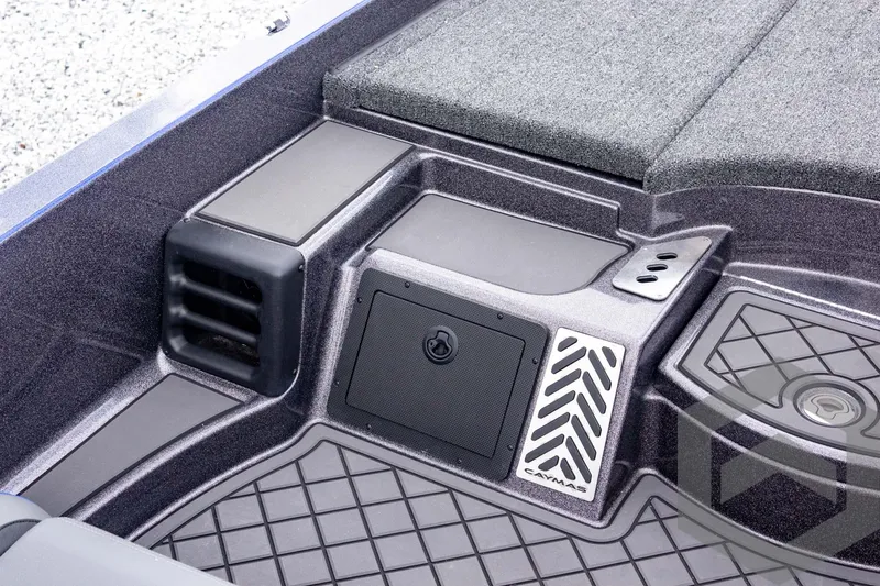 Slide: The Image of 2025 Caymas CX 21 PRO boat interior with storage compartments and textured flooring. - 37
