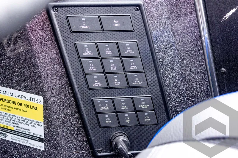 Slide: The Image of Control panel of 2025 Caymas CX 21 PRO boat with labeled switches and capacity warning. - 40