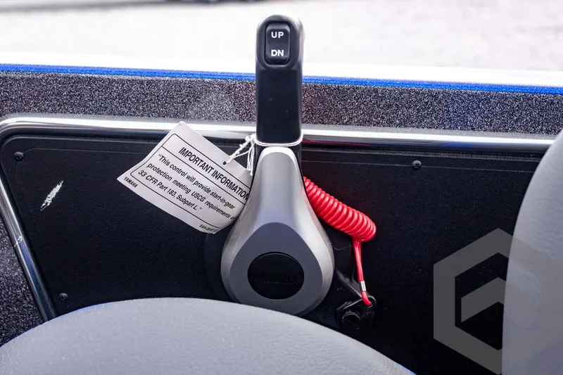 Slide: The Image of Control panel of 2025 Caymas CX 21 PRO boat with up-down lever and safety cord. - 41