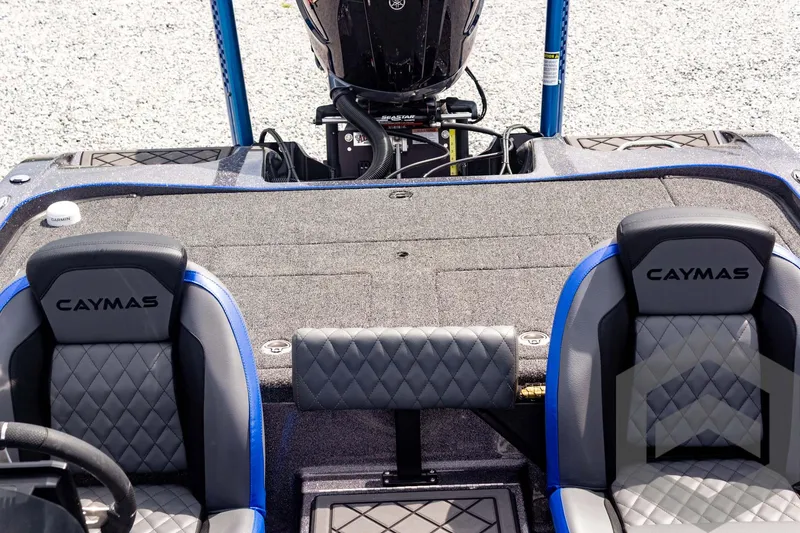 Slide: The Image of 2025 Caymas CX 21 PRO boat interior with dual seats and motor view. - 43