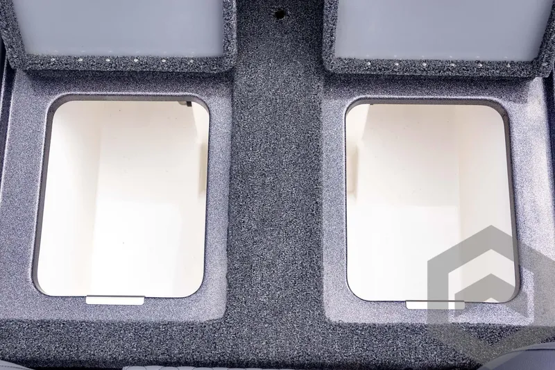 Slide: The Image of 2025 Caymas CX 21 PRO boat storage compartments, open and empty, with textured interior. - 45