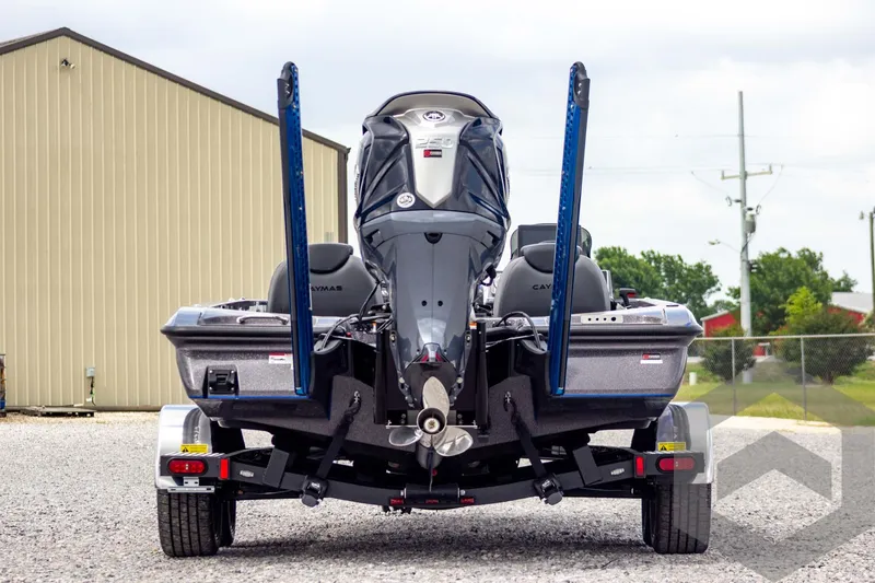 Slide: The Image of 2025 Caymas CX 21 PRO boat rear view, parked on a trailer, showcasing dual power poles. - 5