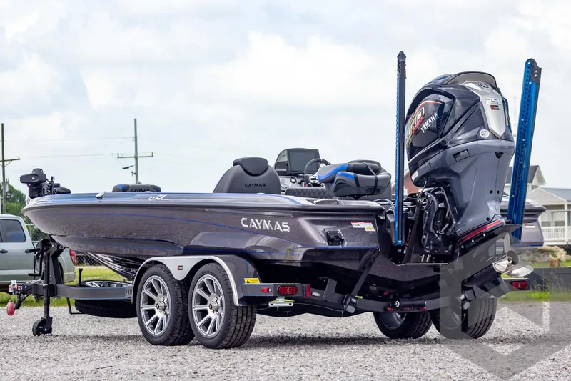 Slide: The Image of 2025 Caymas CX 21 PRO boat on trailer, featuring sleek design and powerful engine. - 6