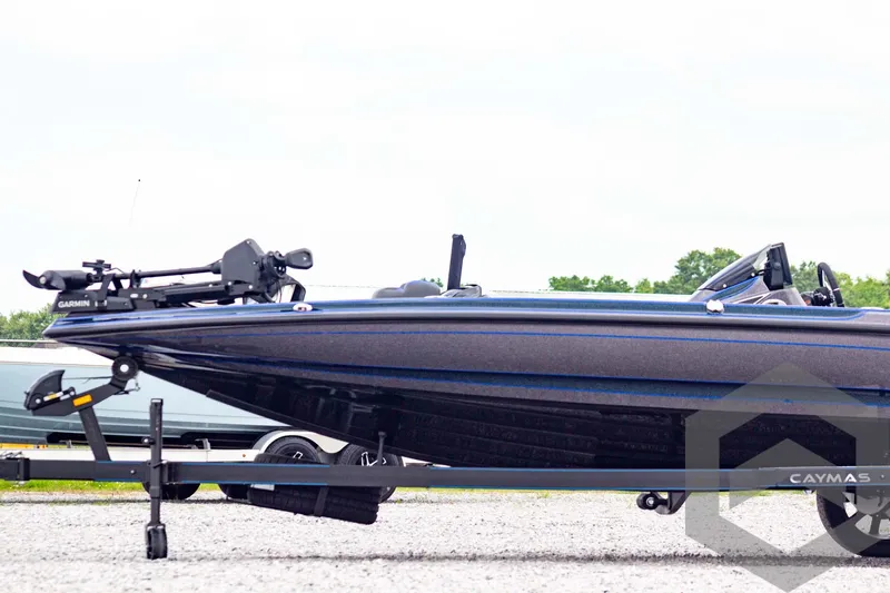 Slide: The Image of 2025 Caymas CX 21 PRO boat on trailer, side view, outdoors. - 8