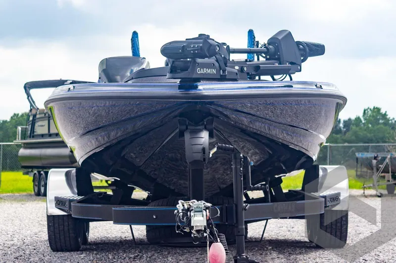 Slide: The Image of 2025 Caymas CX 21 PRO boat on trailer, front view, featuring Garmin equipment. - 9