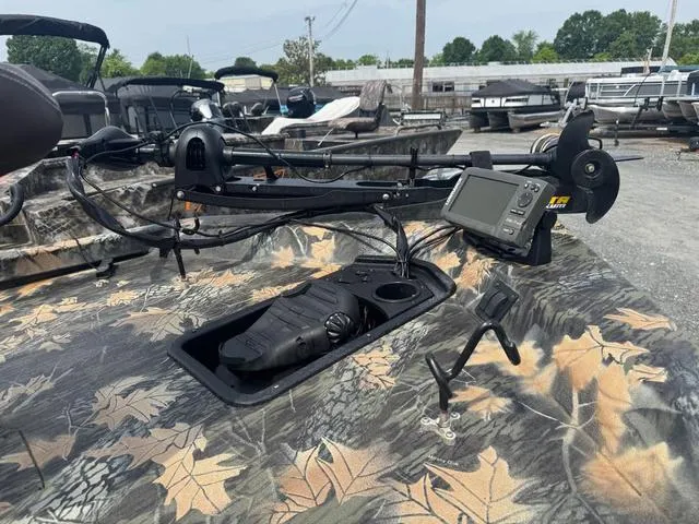 Slide: The Image of 2015 Ranger RT 188 boat with camo design and mounted electronic equipment. - 7