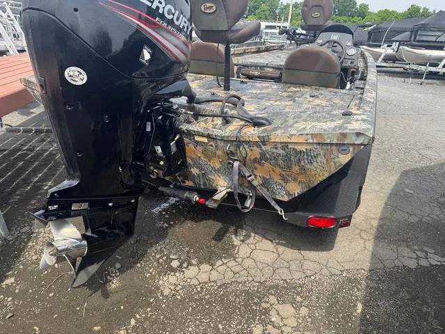 Slide: The Image of 2015 Ranger RT 188 boat with camouflage design and Mercury outboard motor. - 9