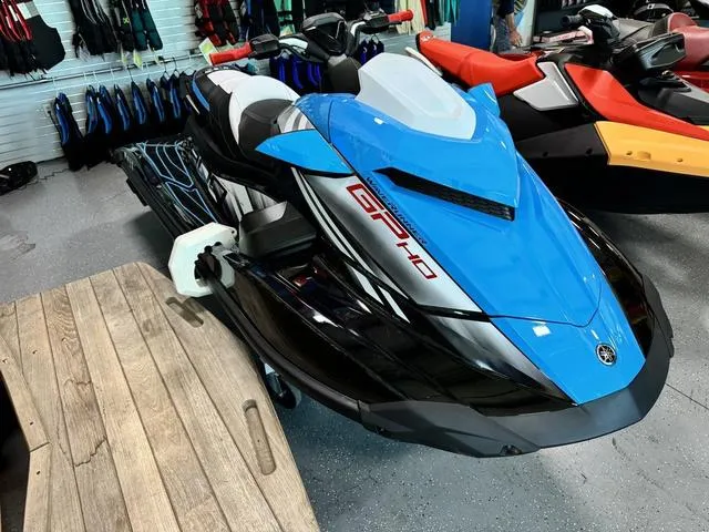 Slide: The Image of 2024 Yamaha WaveRunners GP HO with Audio, blue and black, displayed in showroom. - 5