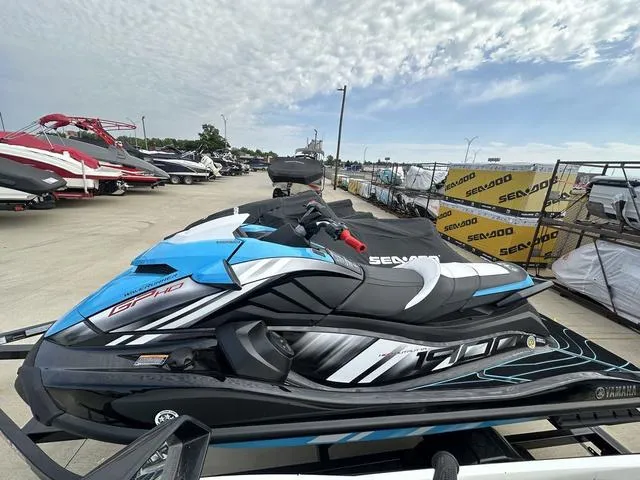 Slide: The Image of 2024 Yamaha WaveRunners GP HO with Audio, blue and black, parked outdoors. - 7