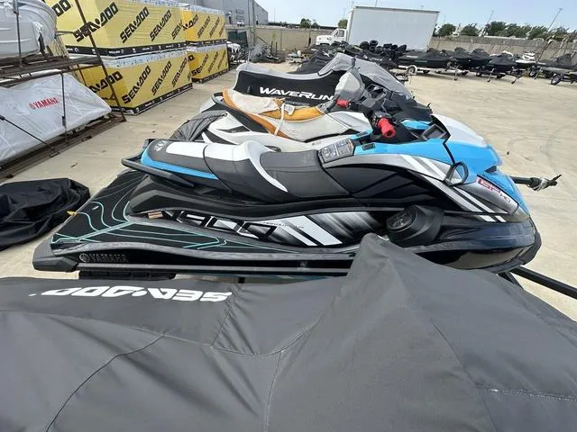 Slide: The Image of 2024 Yamaha WaveRunners GP HO with Audio, blue and black, parked outdoors. - 9