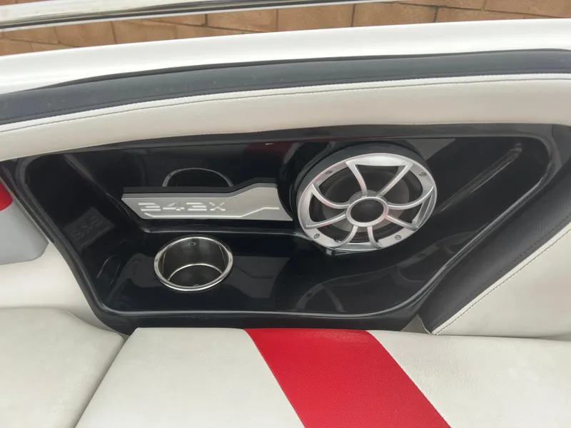 Slide: The Image of 2020 Yamaha Boats 242X interior with speaker and cup holder detail. - 12