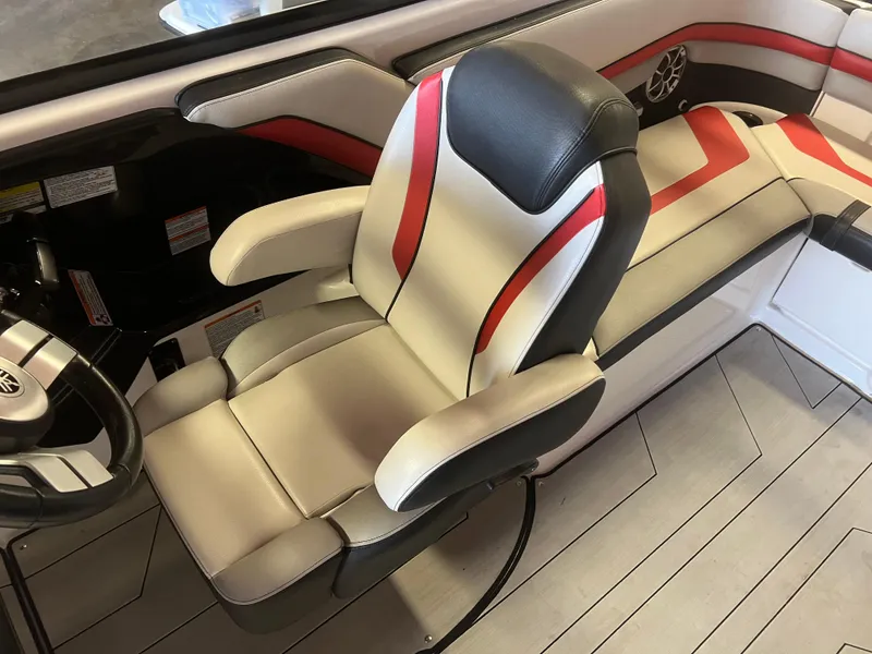 Slide: The Image of 2020 Yamaha Boats 242X interior with stylish captain's chair and modern design. - 13