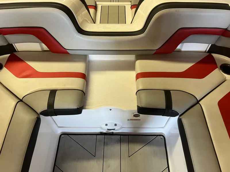 Slide: The Image of 2020 Yamaha Boats 242X interior with red and white seating, modern design. - 20