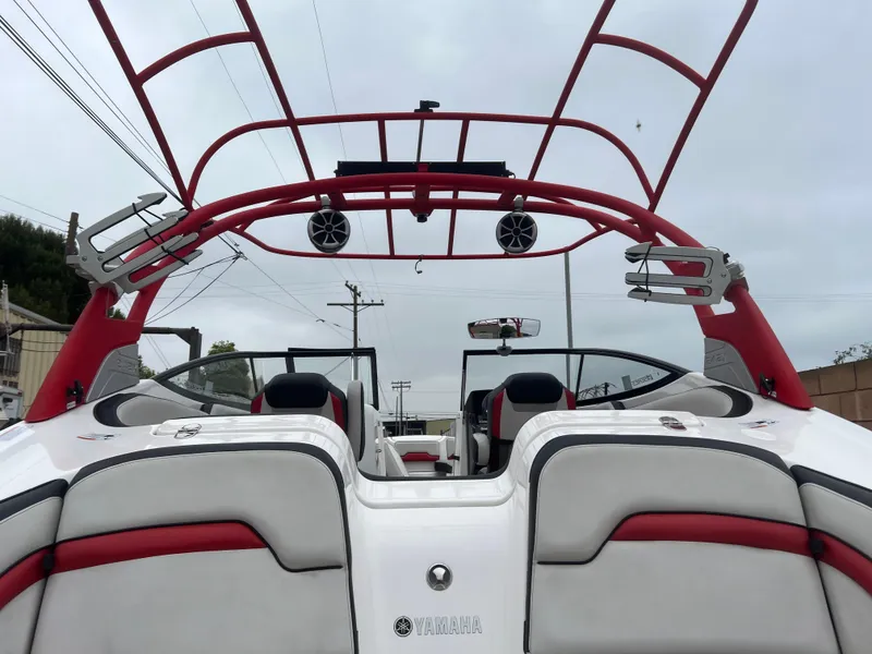 Slide: The Image of 2020 Yamaha Boats 242X with red wakeboard tower and speakers, rear view. - 29