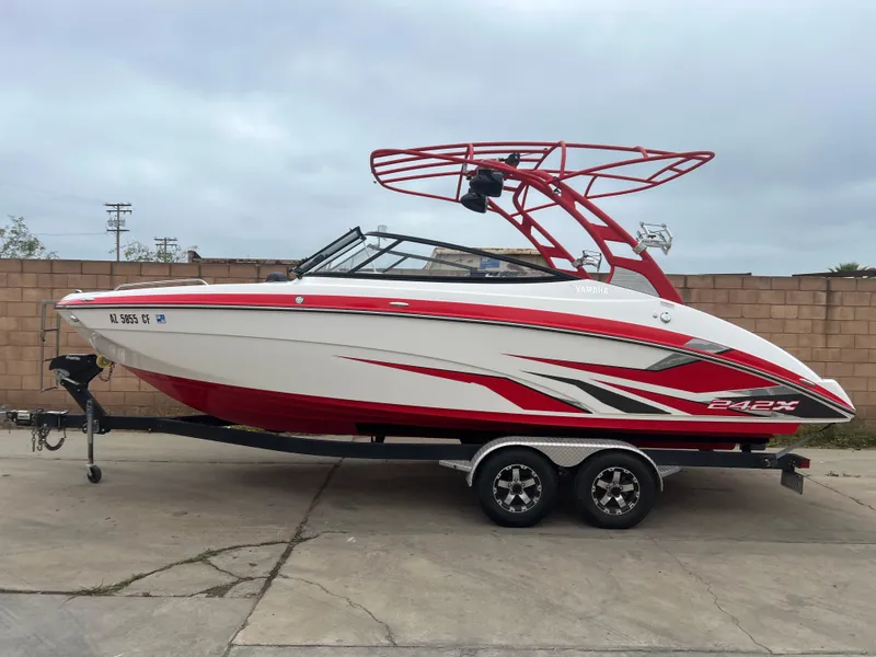 Slide: The Image of 2020 Yamaha Boats 242X in red and white on a trailer. - 3