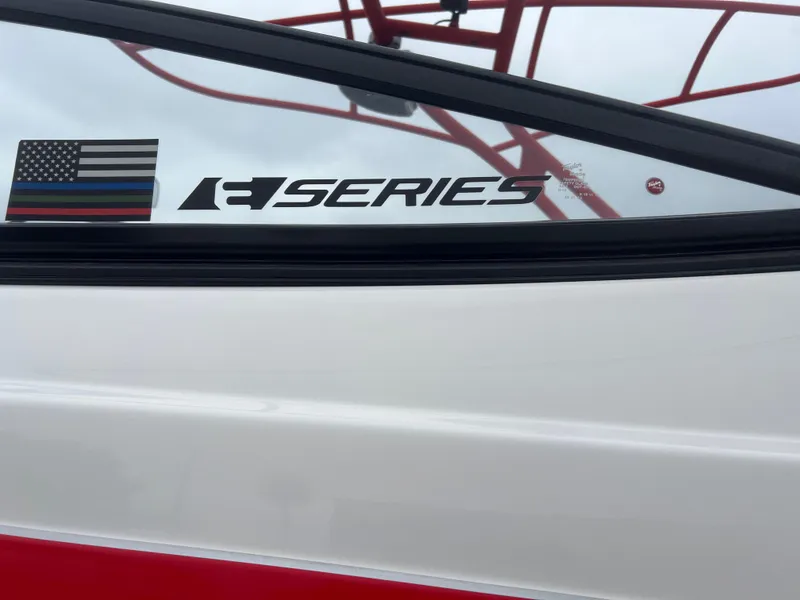 Slide: The Image of 2020 Yamaha Boats 242X, R Series decal, American flag sticker on boat window. - 30