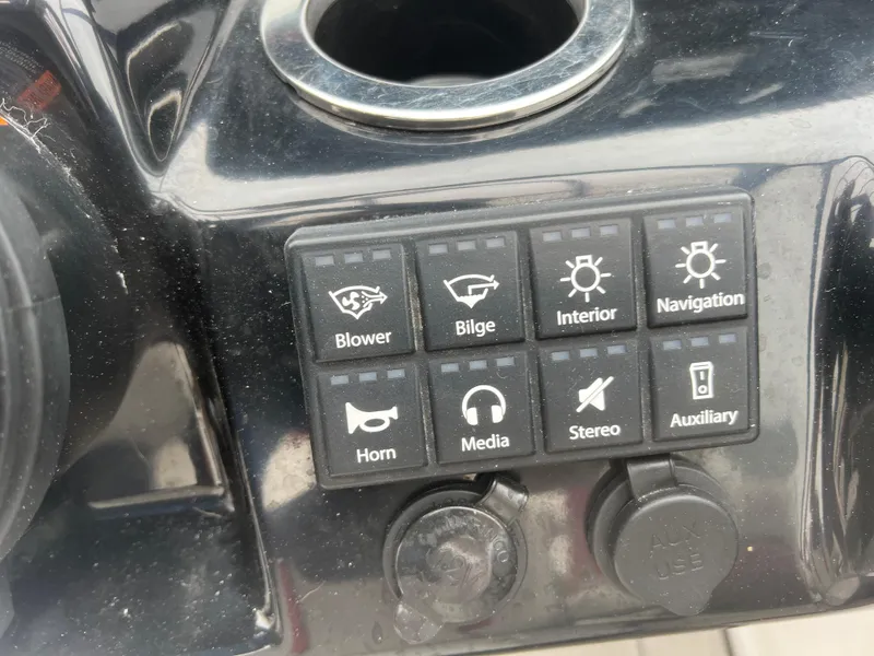 Slide: The Image of Control panel of a 2020 Yamaha Boats 242X with various function buttons. - 34