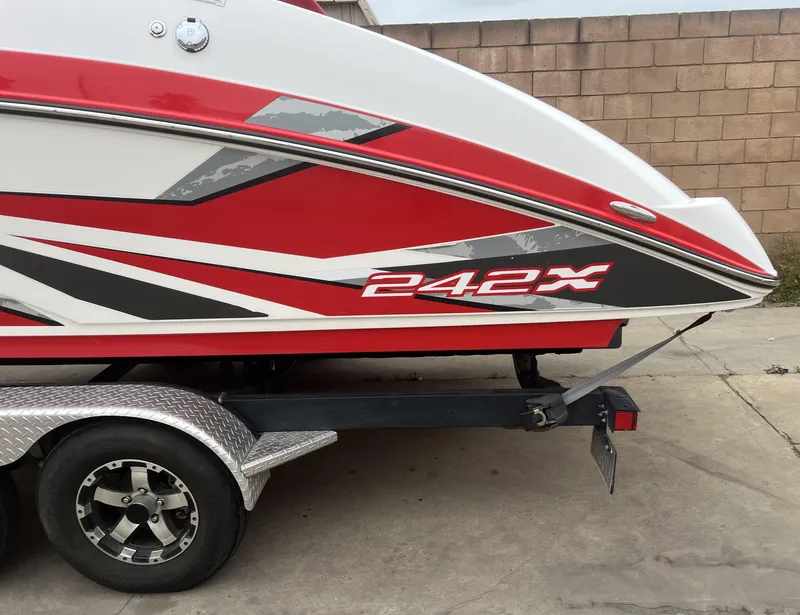 Slide: The Image of 2020 Yamaha Boats 242X in red and white on a trailer. - 6
