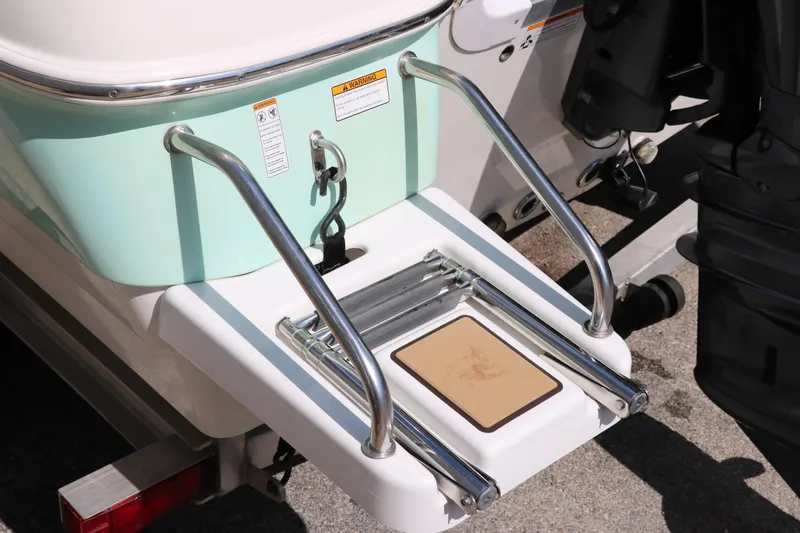 Slide: The Image of 2020 NauticStar 211 Hybrid boat with swim platform and ladder. - 16