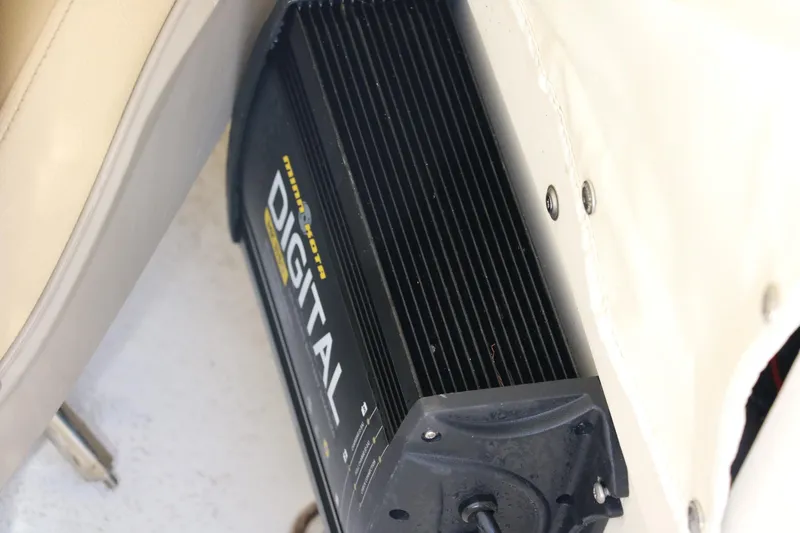 Slide: The Image of 2020 NauticStar 211 Hybrid boat interior storage compartment with seating. - 28