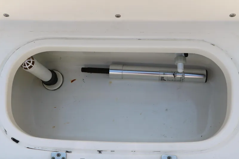 Slide: The Image of 2020 NauticStar 211 Hybrid boat compartment with hydraulic component. - 37