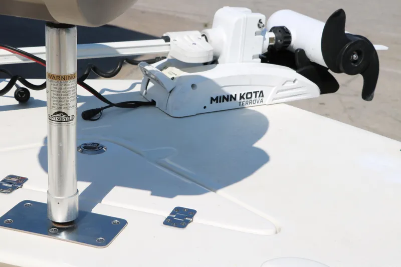 Slide: The Image of 2020 NauticStar 211 Hybrid boat seat with beige upholstery and stainless steel frame. - 40