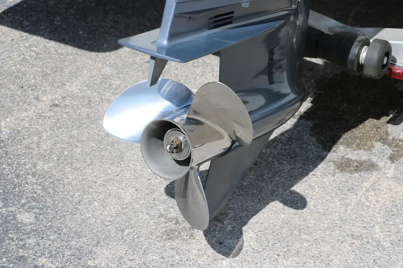 Slide: The Image of Propeller of 2020 NauticStar 211 Hybrid boat on pavement. - 6