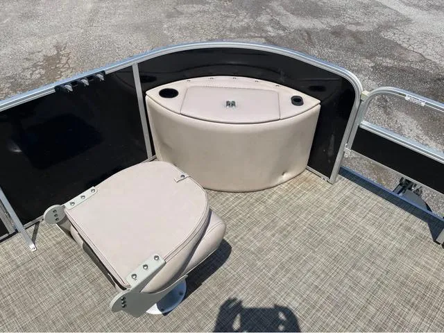 Slide: The Image of 2019 SunCatcher V 322CC boat interior with seating and storage area. - 17