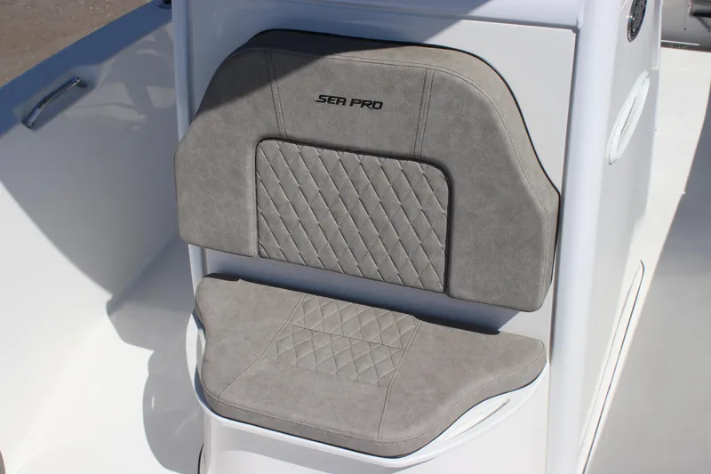Slide: The Image of 2023 Sea Pro 239 Center Console boat seat with gray cushioned upholstery. - 11