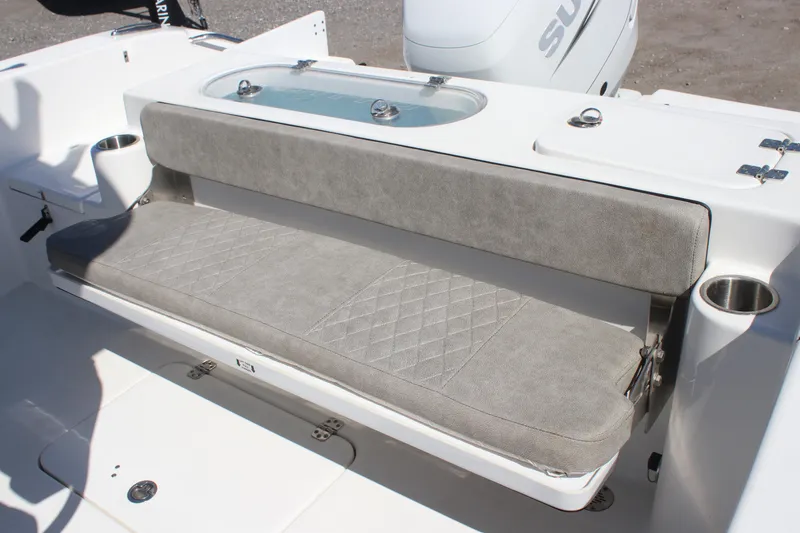 Slide: The Image of 2023 Sea Pro 239 Center Console boat with cushioned seating and cup holders. - 19