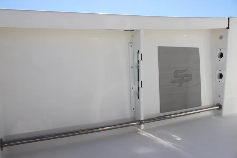 Slide: The Image of 2023 Sea Pro 239 Center Console interior detail with stainless steel rail and logo. - 21