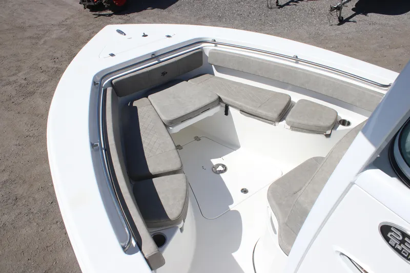 Slide: The Image of 2023 Sea Pro 239 Center Console boat with spacious seating area and cushioned seats. - 7