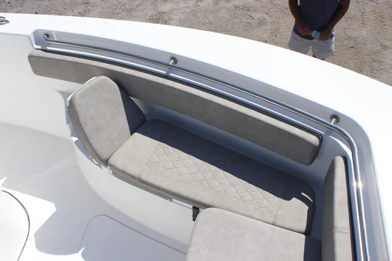 Slide: The Image of 2023 Sea Pro 239 Center Console boat with cushioned seating area. - 9