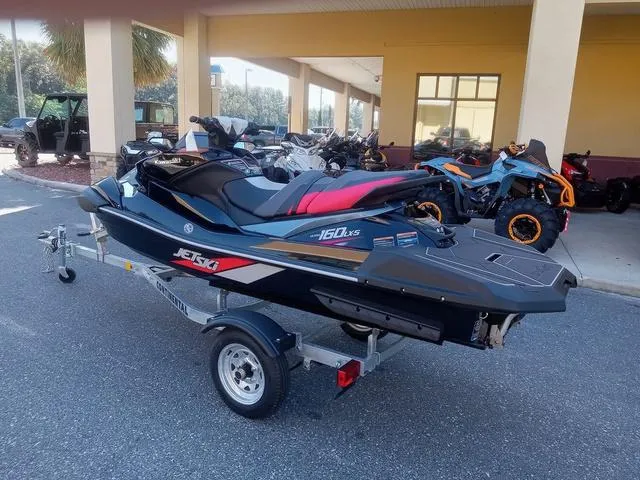 Slide: The Image of 2025 Kawasaki Waverunner Ultra 160LX-S on trailer, parked outdoors. - 13