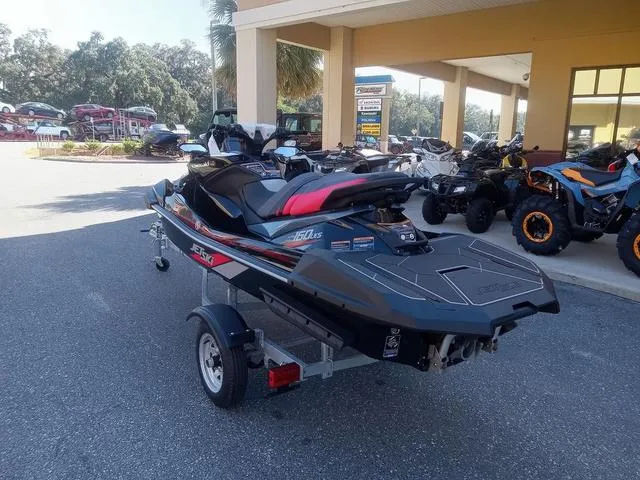 Slide: The Image of 2025 Kawasaki Waverunner Ultra 160LX-S on trailer, parked outside dealership. - 14