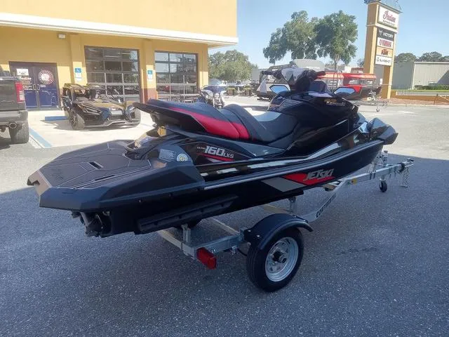 Slide: The Image of 2025 Kawasaki Waverunner Ultra 160LX-S on trailer, parked outside dealership. - 18