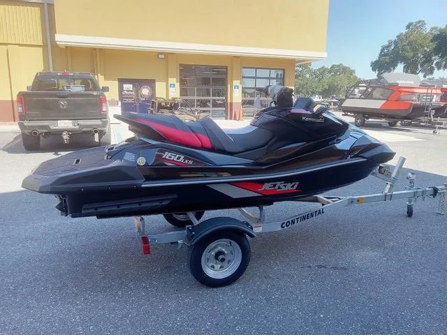 Slide: The Image of 2025 Kawasaki Waverunner Ultra 160LX-S on trailer, parked outdoors. - 19