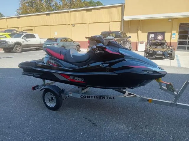 Slide: The Image of 2025 Kawasaki Waverunner Ultra 160LX-S on trailer, parked outdoors. - 5