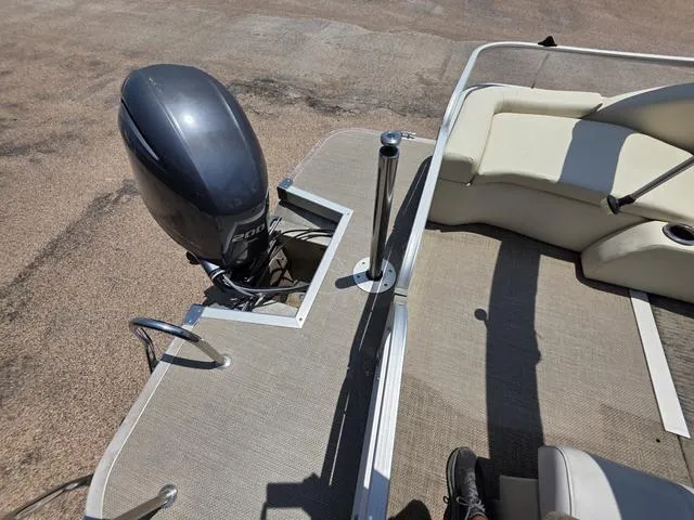 Slide: The Image of 2013 Bennington 2275GLW boat dashboard with steering wheel and control panel. - 12