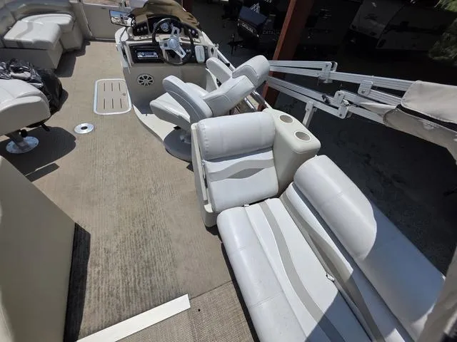 Slide: The Image of 2013 Bennington 2275GLW pontoon boat interior with seating and control panel. - 15